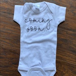 Coming soon announcement shirt.